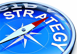 Compass pointing towards the word 'strategy'