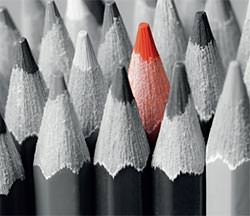 Collection of grey pencils with a single red one in the middle