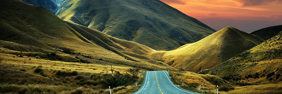 Driving towards a stormy sunset