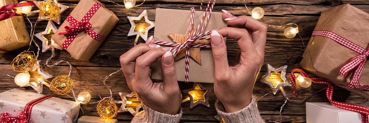 Woman wrapping Chistmas gifts