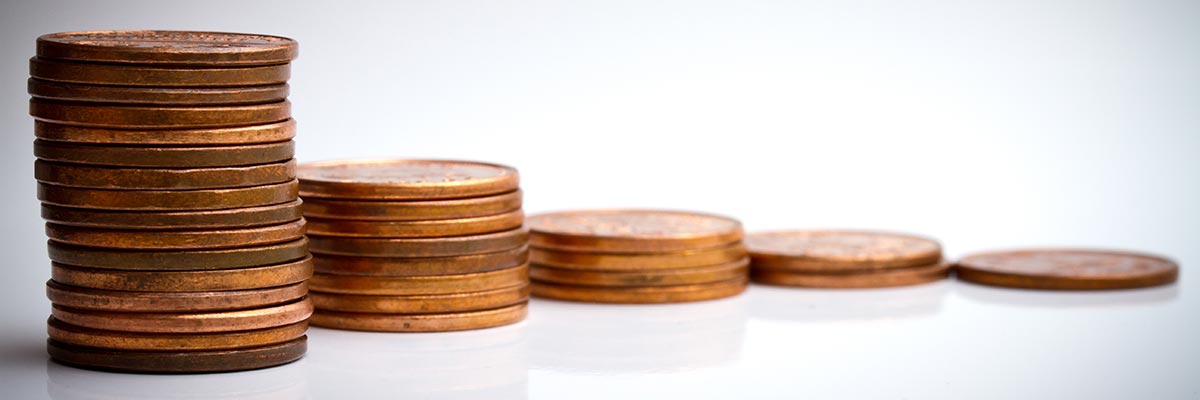 A pile of coins decreasing in size over time