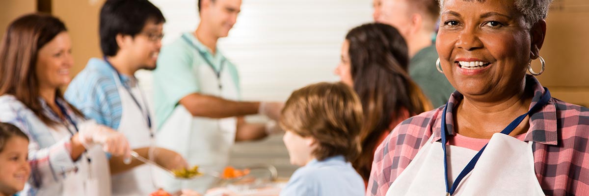 Woman volunteering in a soup kitchen