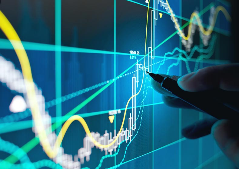 Person tracking share prices on a screen