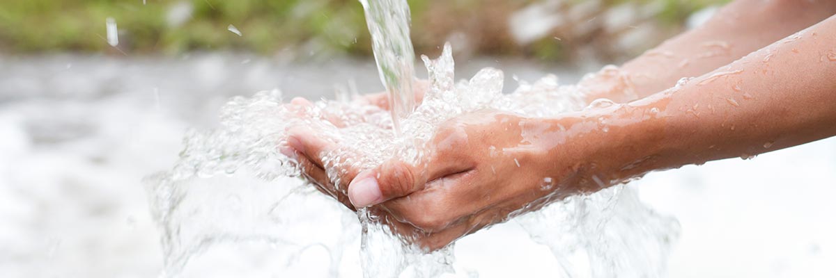 Catching a stream of water in your hands