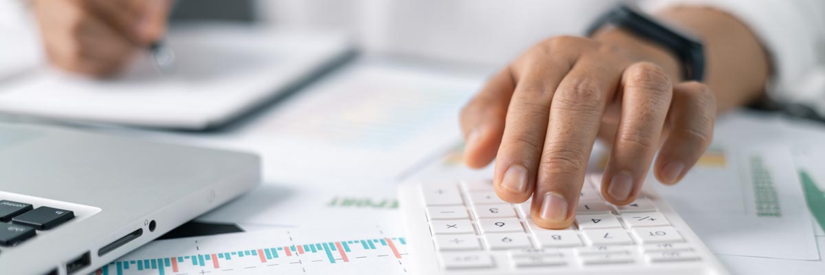 Man using various tools to manage his finances