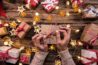 Woman wrapping Chistmas gifts