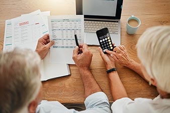 Elderly couple arguing about finances