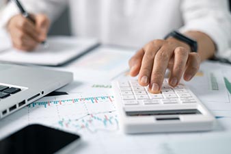 Man using various tools to manage his finances